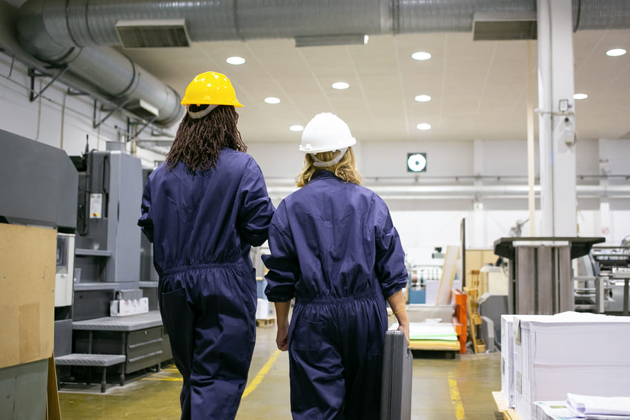 female-factory-workers-hardhats-overalls-walking-plant-floor-talking-carrying-toolkit-box (1) (1).jpg female-factory-workers-hardhats-overalls-walking-plant-floor-talking-carrying-toolkit-box (1) (1).jpg